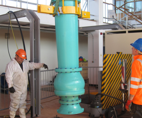 Clean water pump being lifted in to position during mechanical installation