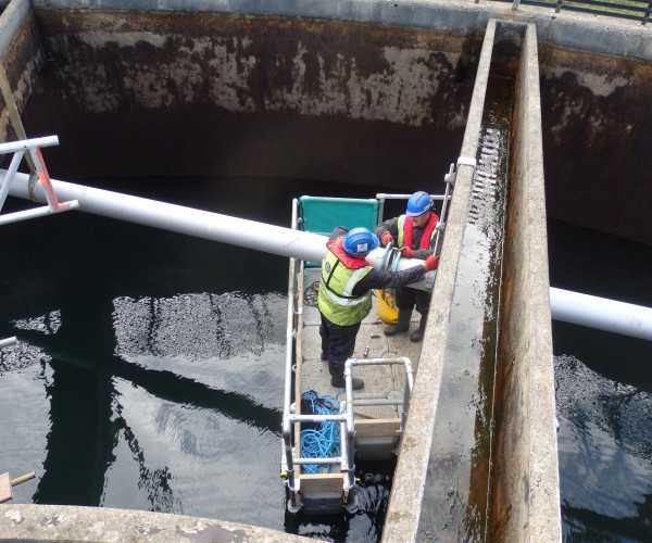 Using a raft to undertake installation of new pipework over tanks